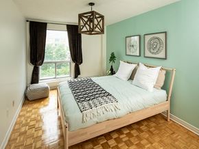 Ottawa apartment for rent - a bedroom with a bed and a window