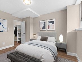 Ottawa apartment for rent - a bedroom with a bed and a closet
