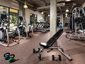 Long Beach apartment for rent - a gym with a lot of exercise equipment in it