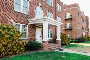 Lexington apartment for rent - A red brick building with a white door and windows.