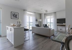 Oshawa apartment for rent - a living room with a couch and a table