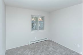 Sterling Heights apartment for rent - a bedroom with white walls and carpet and a window