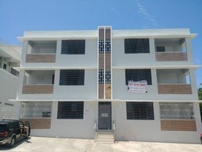 San Juan apartment for rent - the outside of a building with a car parked in front of it