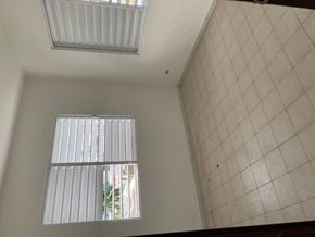 San Juan apartment for rent - the living room with two windows and a tiled wall