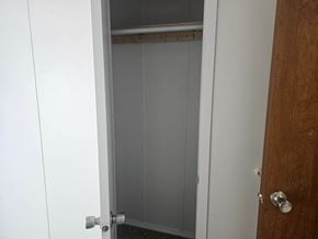 Shawnee house for rent - A white door with a silver handle is open.
