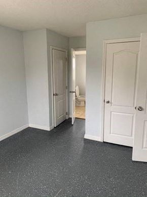 Orlando apartment for rent - an empty room with white doors and a door to a bathroom