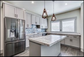 Sacramento apartment for rent - a kitchen with white cabinets and stainless steel appliances