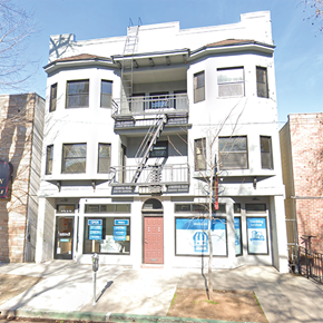 Sacramento apartment for rent - a white building with a staircase on the side of it