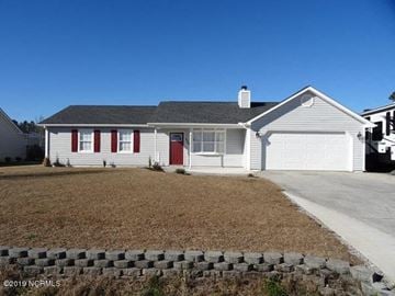 Hubert house for rent - a white house with red doors and a driveway