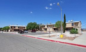 El Paso apartment for rent - a street with cars parked in front of buildings