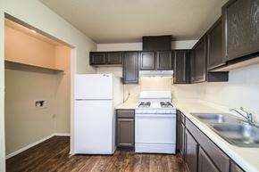 El Paso apartment for rent - A kitchen with a white refrigerator, stove, and oven.