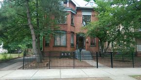 New Haven apartment for rent - a brick house with a black fence in front of it