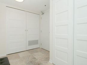 Ottawa apartment for rent - a bedroom with white doors and a closet
