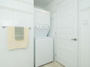 Ottawa apartment for rent - a white laundry room with a washer and dryer in it