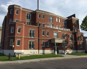 Ottawa apartment for rent - A red brick building with a fire hydrant in front.