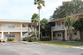 Clearwater apartment for rent - A building with a parking lot in front of it.