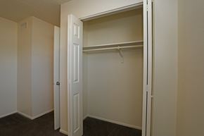 Largo apartment for rent - A white closet with a door and a shelf.