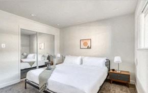 Sunnyvale apartment for rent - a bedroom with a bed and a mirror
