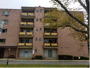 Baltimore apartment for rent - A tall apartment building with a sign that says "NO PARKING".