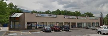Colorado Springs apartment for rent - A parking lot in front of a building with a sign that says "The Local".