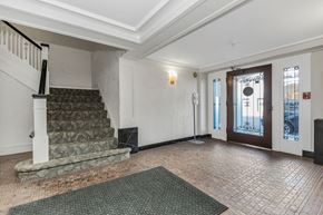 San Francisco apartment for rent - A room with a staircase and a door leading to a balcony.