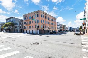 San Francisco apartment for rent - A street view of a city intersection with a traffic light showing red.
