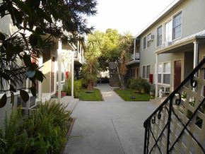 Valley Village apartment for rent - the walkway between the apartments is lined with palm trees