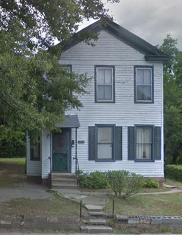 Richmond apartment for rent - A white house with a green door and a small porch.
