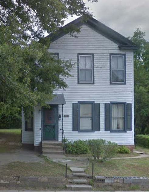Richmond apartment for rent - A white house with a green door and a small porch.
