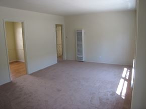 Valley Village apartment for rent - an empty living room with white walls and a wood floor