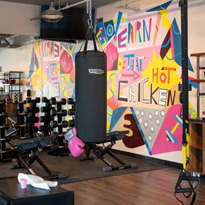 Nashville apartment for rent - A gym with a punching bag and weights.