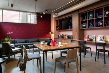 Nashville apartment for rent - A modern living room with a wooden table and chairs.