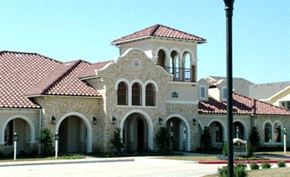 San Antonio apartment for rent - a large house with a red roof and a street light