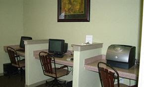 San Antonio apartment for rent - a room with a desk with a computer and a television