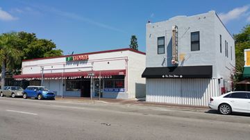 Miami apartment for rent - the front of a restaurant on the side of a city street