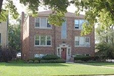 River Forest apartment for rent - A red brick building with a white door and windows.
