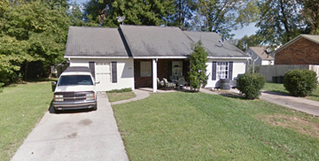 New Albany house for rent - A house with a white picket fence and a car parked in front.