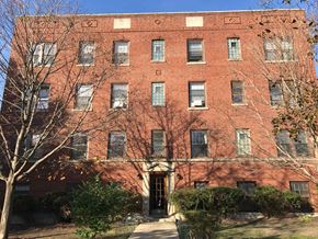 Evanston apartment for rent - A red brick building with a tree in front.