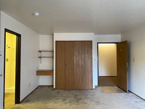 Lodi apartment for rent - a living room with a closet and a door to a hallway