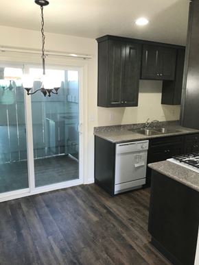 Lockeford apartment for rent - an empty kitchen with a sliding glass door to the bathroom
