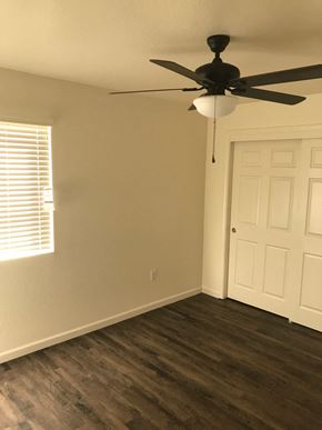 Lockeford apartment for rent - a living room with wood floors and a ceiling fan