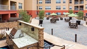 Open air courtyard with viking bbq grill and fire pit lounge area