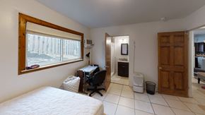 Ann Arbor apartment for rent - a bedroom with a bed and a desk and a window
