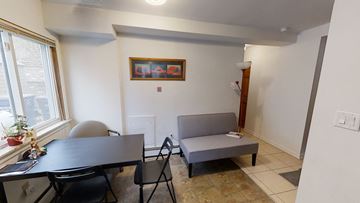 Ann Arbor apartment for rent - a dining room and living room with a table and a couch