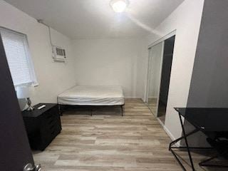 Ann Arbor apartment for rent - A bedroom with a bed, nightstand, and chair.
