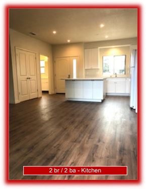 Gilroy apartment for rent - an empty kitchen and living room with wood floors