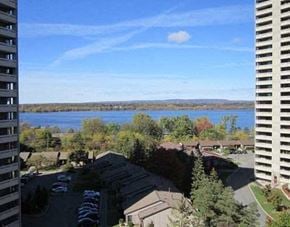 Ottawa apartment for rent - a view of a lake from a building with a balcony