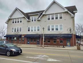 Port Washington apartment for rent - a house on the corner of a street with a car