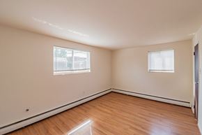 Philadelphia apartment for rent - the spacious living room with hardwood flooring and two windows