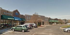 Kansas City apartment for rent - A parking lot in front of a Salon Inspire.